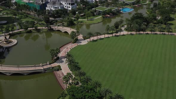 aerial view of a beautifully landscaped park on a clear sunny day with colorful children's playgroun