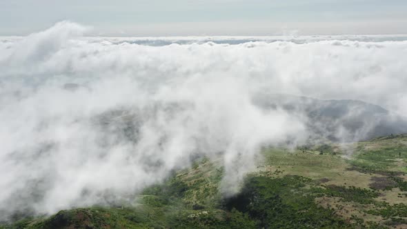 Aerial View of the Green Vegetation on the Top of a Plateau Surrounded with Sky