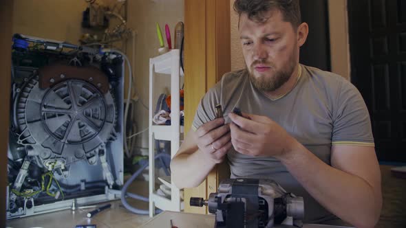 Young Housewife Does Not Know How to Fix His Broken Washing Machine