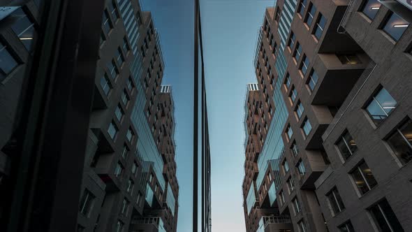 Reflective Mirror Glass Building Against Blue Sunset Sky In Barcode Project, Downtown Oslo, Norway -