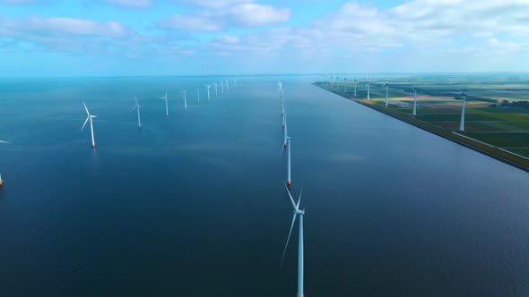 Offshore Windmill Park with Clouds and a Blue Sky Windmill Park in the Ocean Drone Aerial View with