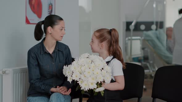 Close Up of Mother and Child in Waiting Area Preparing to Visit Patient