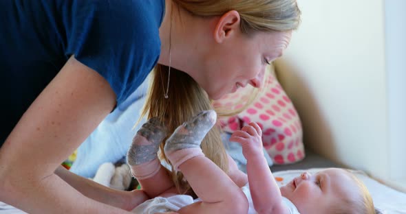 Mother playing with her baby boy at home 4k alt