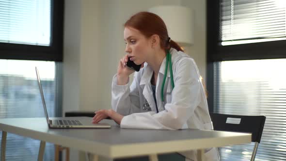 Tracking Shot of Worried Female Doctor Talking on Mobile Phone with Patient and Searching Info Using