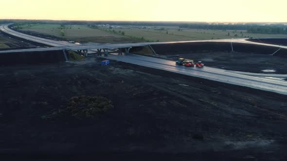 Flight Over a Road Junction Under Construction at Sunset