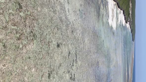 Vertical Video of Low Tide in the Ocean Near the Coast of Zanzibar Tanzania Aerial View