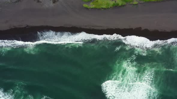 Aerial Top View of Beach with Black Sand