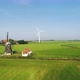 Windmill and wind turbines in field, Tjerkwerd, Nederland - VideoHive Item for Sale