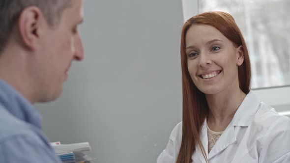 Female Doctor Giving Prescription