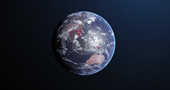 Animation of the planet earth spinning around and changing colors in a blue dark background alt