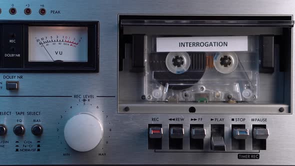 Interrogation Audio Cassette Tape Recording Rolling in Vintage Deck Player