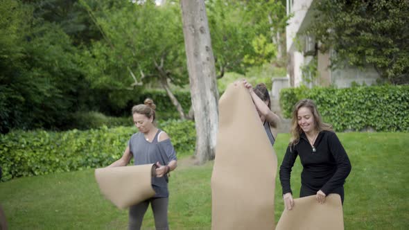 Trainer and Yoga Group in Park