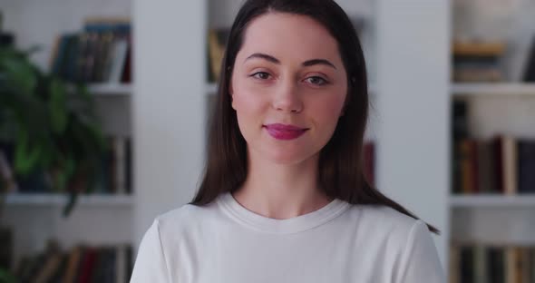 Close Up Portrait of Delicate Girl Smiling To Camera Indoors on Room Apartment Background