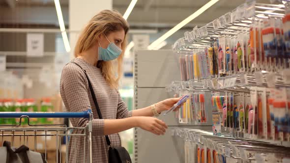 Bayer In Medical Mask In Supermarket Avoid Self Distance. Girl In Face Mask Shopping In Market.