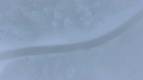 Aerial Drone Flying through Clouds in the Winter