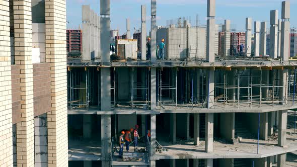 Timelapse of Builders Working in a House Under Construction alt