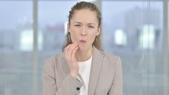 Portrait of Beautiful Young Businesswoman Having Toothache