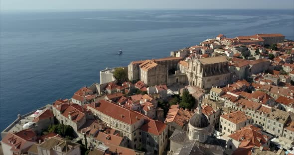 Aerial shot of Dubrovnik Old Town. the camera orbits the natural history museum and shows the city w