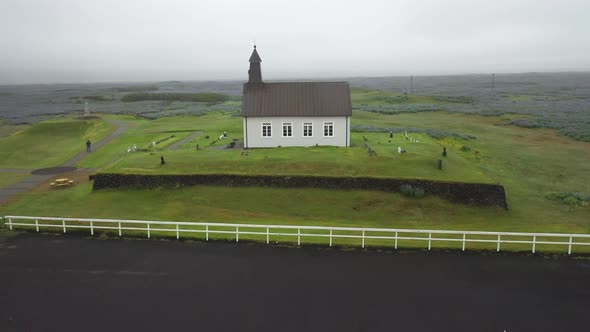 Strandarkirkja church in Iceland with drone video circling moving up