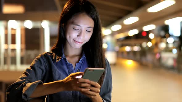 Young Woman Use of Smart Phone in City 