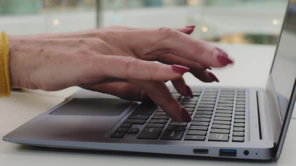 Female Hands Mature Businesswoman Closeup Caucasian Woman Typing on Keyboard Laptop Professional
