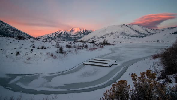 Time Lapse of Frozen Lake and Snow Covered Mountains