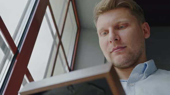 Young businessman with photo frame