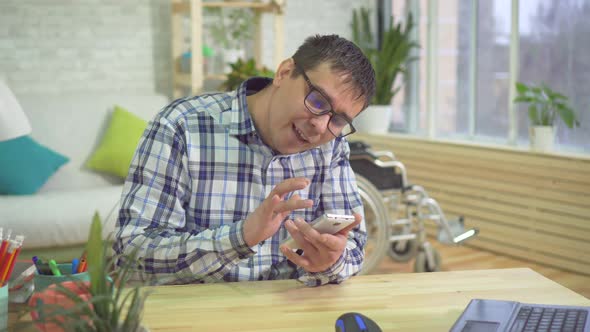 Adult Male Disabled Person Using Mobile Phone