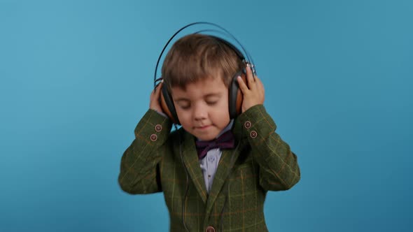 Handsome Little Toddler Boy Listening to Music with Old Headphones Child Having Fun Funny Dancing in