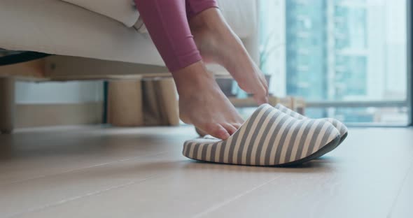 Woman wear slipper at home