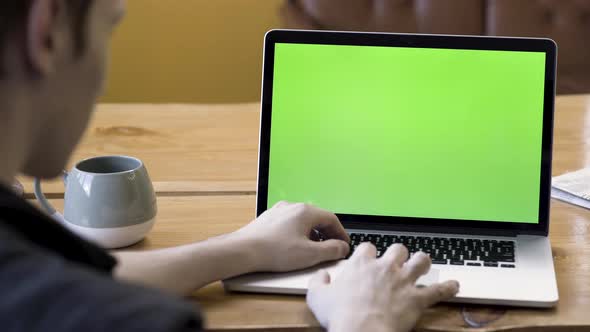 Male hands using touch pad