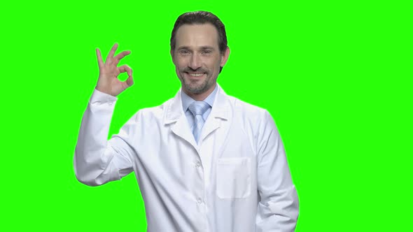 Middle Aged Male Caucasian Doctor with Ok Sign