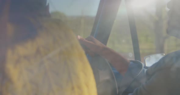 Young couple on a road trip in their pick-up truck