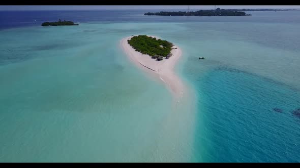 Aerial flying over landscape of luxury resort beach voyage by transparent water and white sandy back