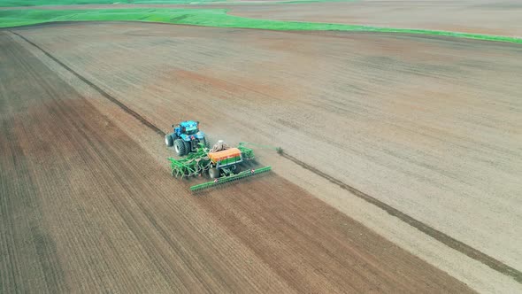 Top View of a Seeding Machine Sowing the Field