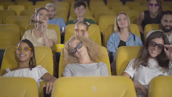 Laughing People Leaving Lonely Sleeping Woman in 3d Cinema. Portrait of Exhausted Caucasian Lady