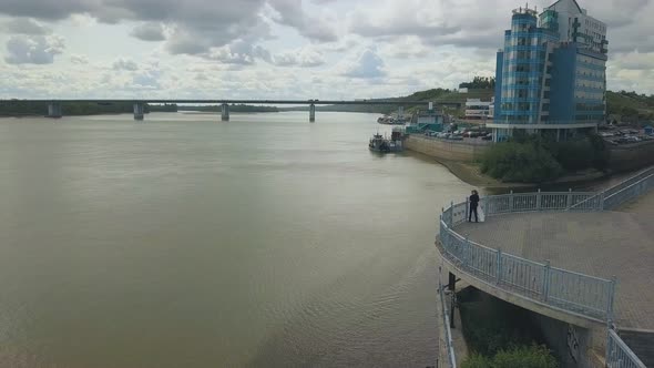 Just Married Couple on Viewpoint Over Large River Upper View