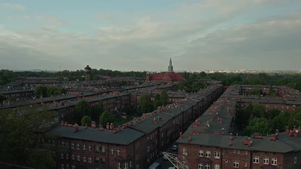 Aerial View Of Red Brick Apartments In Nikiszowiec, Katowice, Poland With St. Anne Parish Church In