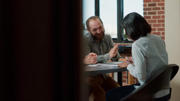 HR Team Congratulating Female Candidate on Making Deal