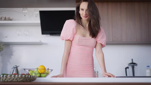 Medium Shot Portrait of Young Slim Beautiful Brunette Woman with Grey Eyes Looking at Camera Smiling