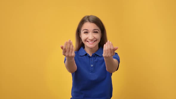 Portrait of Cheerful Young Woman Smiling with Gesture Come Here Asking Joining to Her Posing