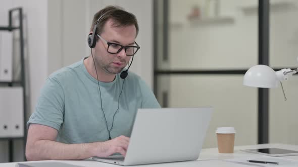 Smiling Young Man Wearing Headset Call Center