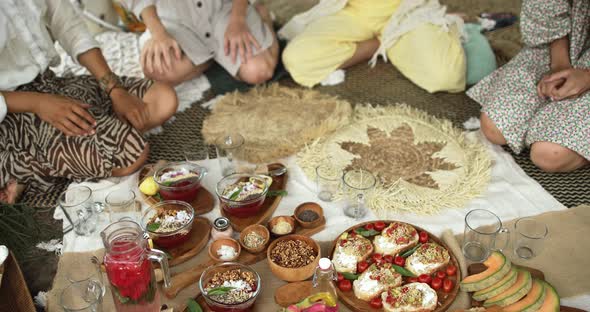 A Group of Girls Socialize During a Beautiful Vegetarian Picnic