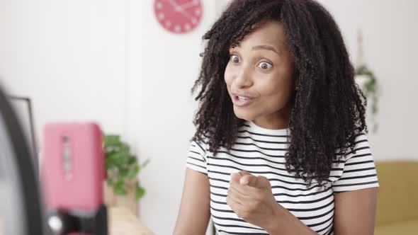 Young Woman Recording Video Blog Content for Her Social Networks Using Phone