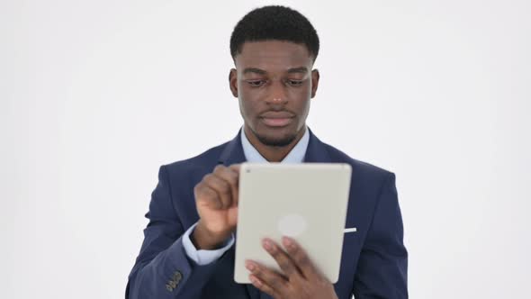 African Businessman Using Digital Tablet on White Background