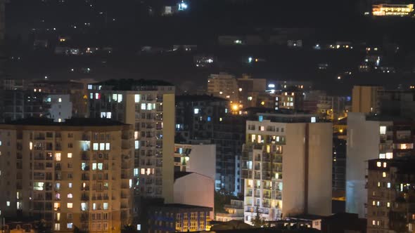 Multistorey Buildings with Changing Window Lighting At Night in City. Timelapse