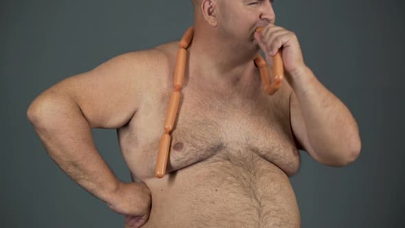 Chubby Man Eating Sausages with Appetite, Food Addiction, Risk of Diabetes