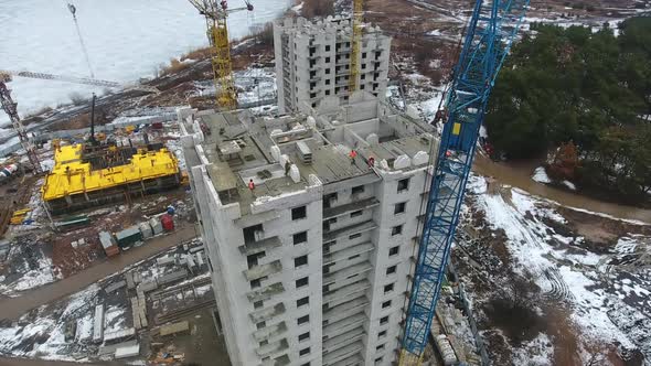 Aerial of People Working at Construction Site of Skyscraper