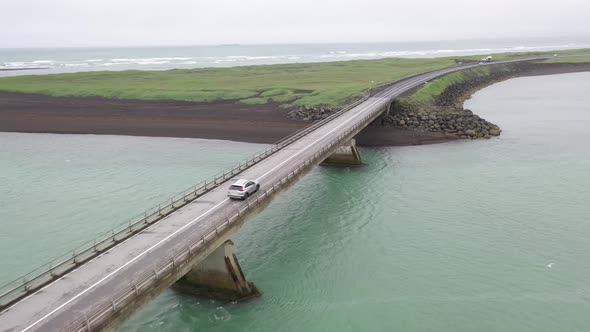 Iceland Car with Bridge at Black Beach