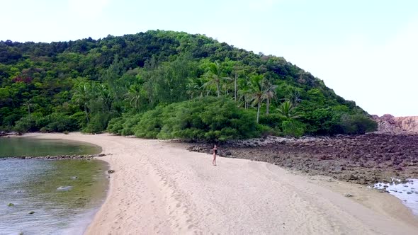 Young Pretty Woman in Black Swimsuit Standing Alone on a SandbarThailand